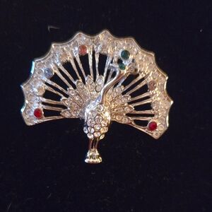 Elegant Silver Peacock Brooch with Gem Accents